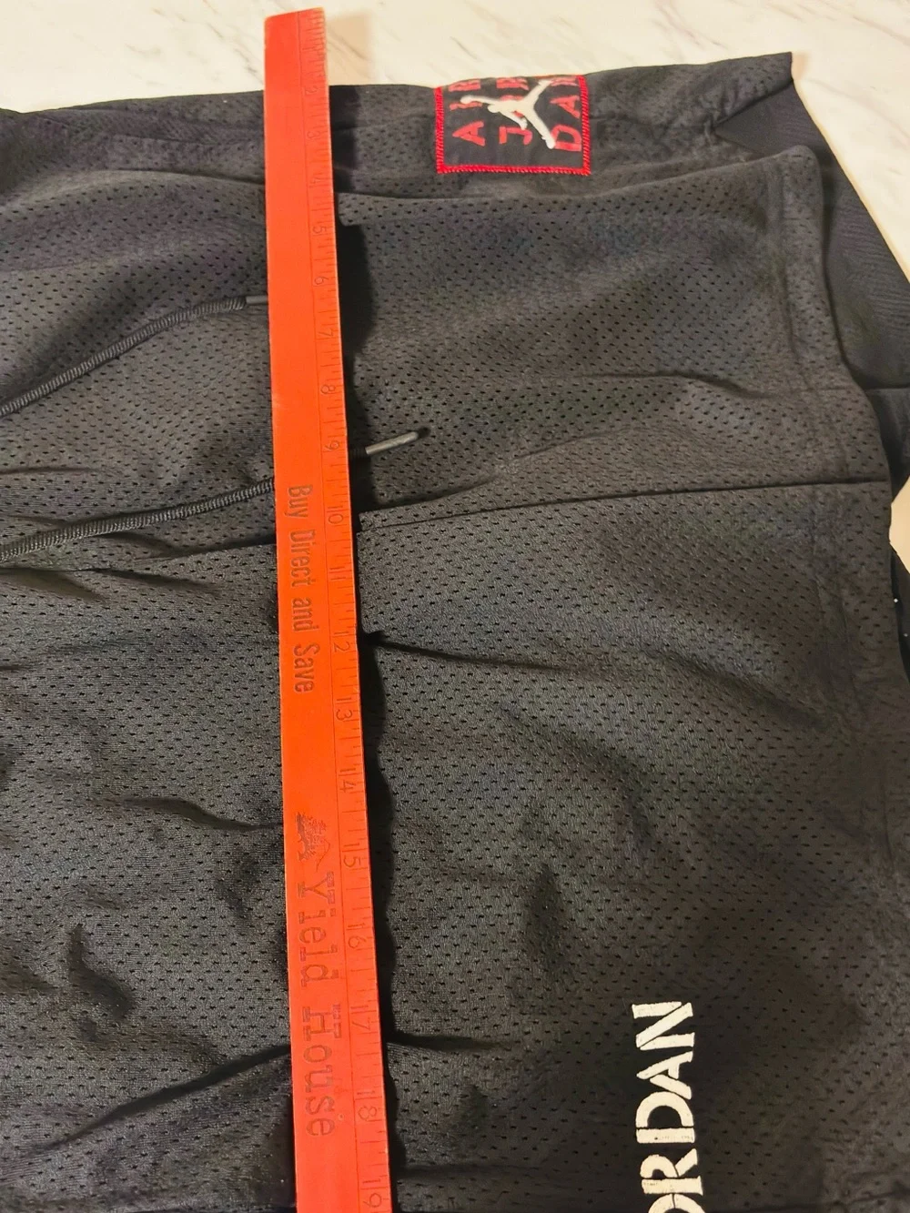 Jordan Black Athletic Mesh Shorts with Red Logo Accent